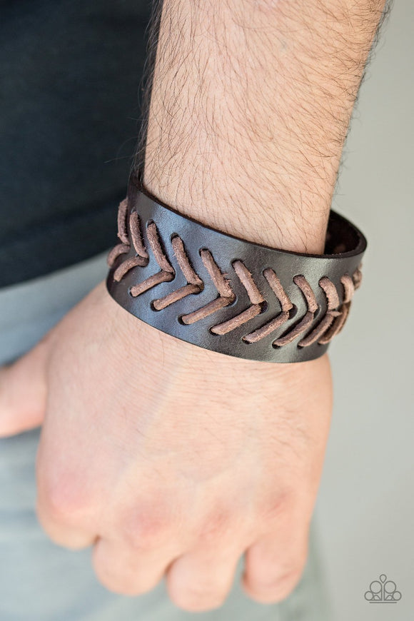 Paparazzi Take Me Out To The Ball Game - Brown - Bracelet
Distressed brown leather cording is stitched across the front of a thick leather band for a rugged look. Features an adjustable snap closure.
