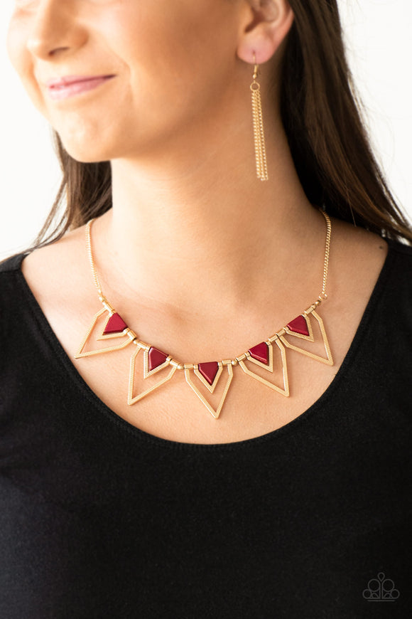 Paparazzi The Pack Leader - Red-Gold - Necklace
Infused with robust red beading, glistening gold triangular frames join below the collar, creating a fierce geometric fringe. Features an adjustable clasp closure.