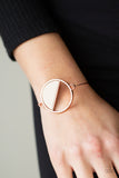 Paparazzi Timber Trade - Copper - Bracelet
Attached to a dainty shiny copper bar that curls around the wrist, a crescent shaped white wooden accent adorns half of an airy circular centerpiece for a modern twist. Features a toggle closure.
