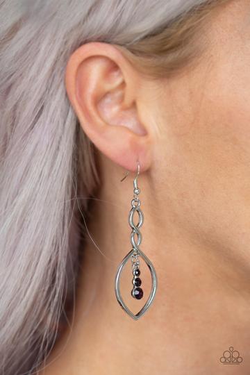 Paparazzi Timeless Twist - Purple - Earrings
A glistening silver ribbon twists into an elegant lure. Gradually increasing in size, a trio of glassy purple rhinestones swing from the top of the frame for a dazzling finish. Earring attaches to a standard fishhook fitting.