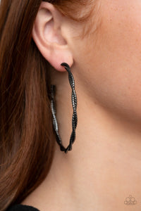 Paparazzi Totally Throttled - Black Gunmetal - Earrings
Featuring diamond-cut shimmer, two glistening gunmetal wires delicately twist into an oversized hoop for an edgy look. Earring attaches to a standard post fitting. Hoop measures approximately 2 3/4" in diameter.
