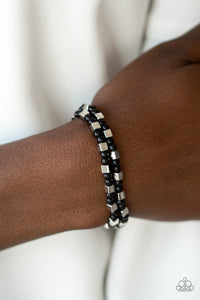 Paparazzi Trendy Tribalist - Black - Bracelet
A collection of dainty black beads and silver cube beads are threaded along stretchy bands around the wrist, creating colorful layers.
