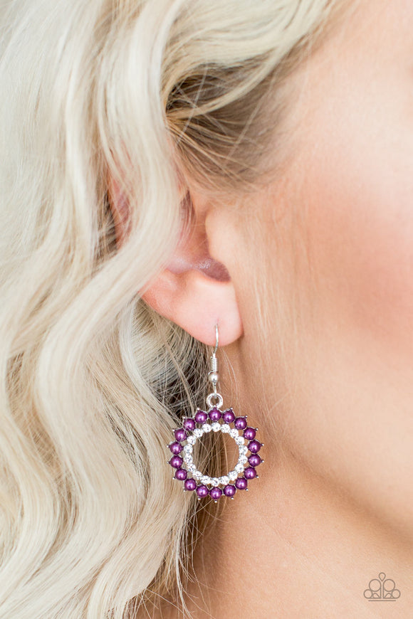 Paparazzi Wreathed in Radiance - Purple - Earrings
Dainty Magenta Purple pearls spin around a radiant white rhinestone center, coalescing into a refined hoop. Earring attaches to a standard fishhook fitting.