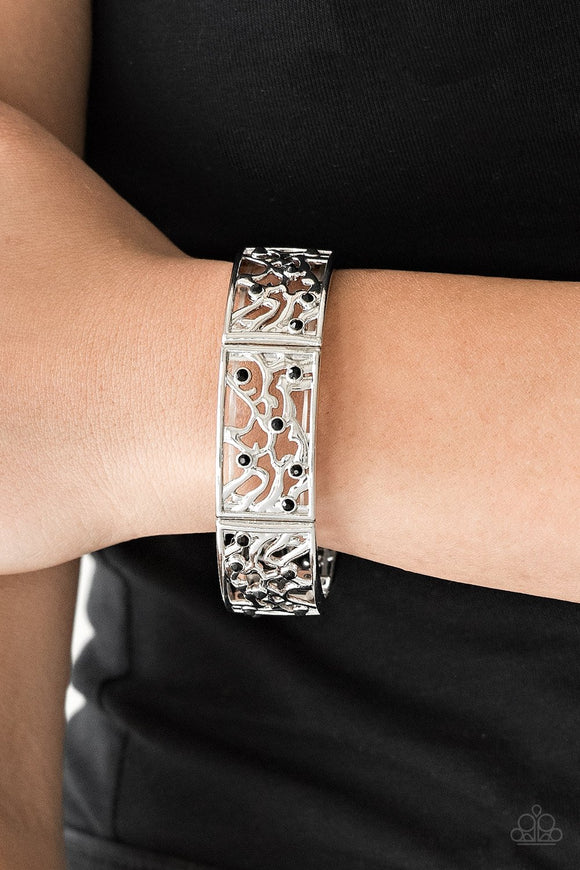 Paparazzi Yours And VINE - Black - Bracelet
Filled with vine-like filigree, shimmery silver frames are threaded along stretchy bands around the wrist for a whimsical look. Dainty black rhinestones are sprinkled along the ornate frames for a sparkling finish.
