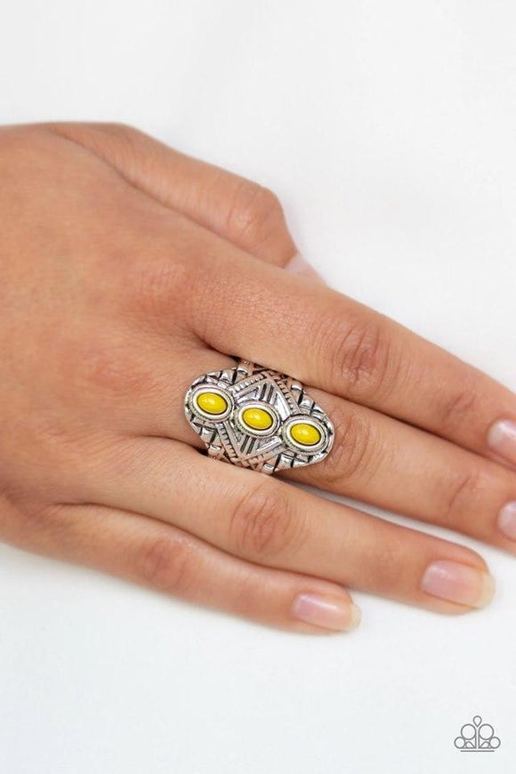 Paparazzi Mayan Motif - Yellow Three dainty yellow beads stack along the center of an ornate silver frame embossed in shimmery geometric patterns for a bold tribal look. Features a stretchy band for a flexible fit.
